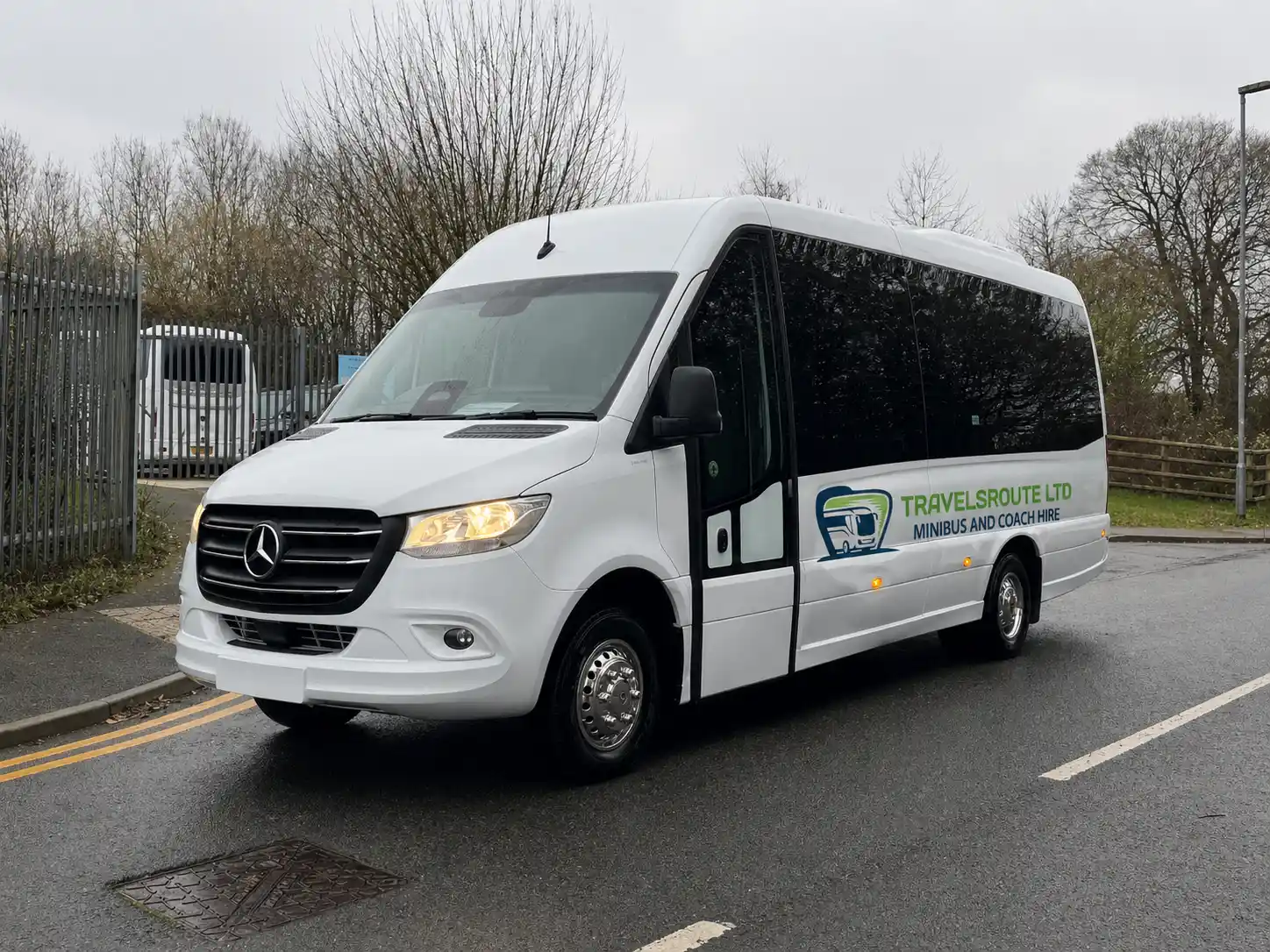 White minibus on an open road, as on the run from Sheffield over the moors into the Peak District